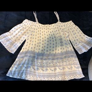 Quarter flow off the shoulder flounce top